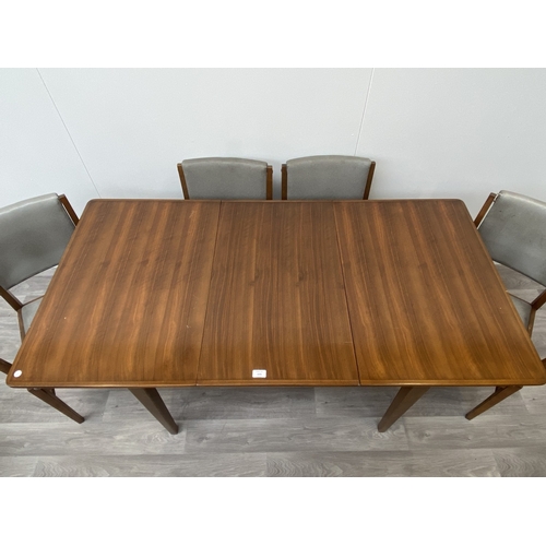 1131 - A mid 20th century Gordon Russell walnut dining table and eight chairs with grey vinyl upholstery - ... 