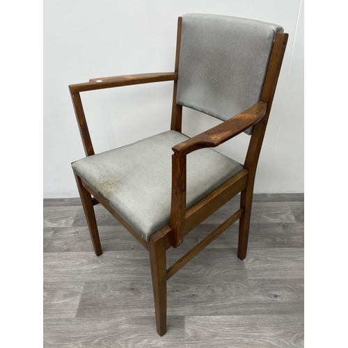 1131 - A mid 20th century Gordon Russell walnut dining table and eight chairs with grey vinyl upholstery - ... 