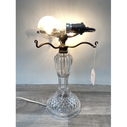 1133 - A Stuart cut crystal and silver plated twin branch table lamp - approx. 32cm high