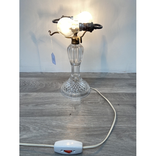 1133 - A Stuart cut crystal and silver plated twin branch table lamp - approx. 32cm high