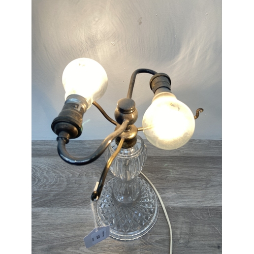 1133 - A Stuart cut crystal and silver plated twin branch table lamp - approx. 32cm high