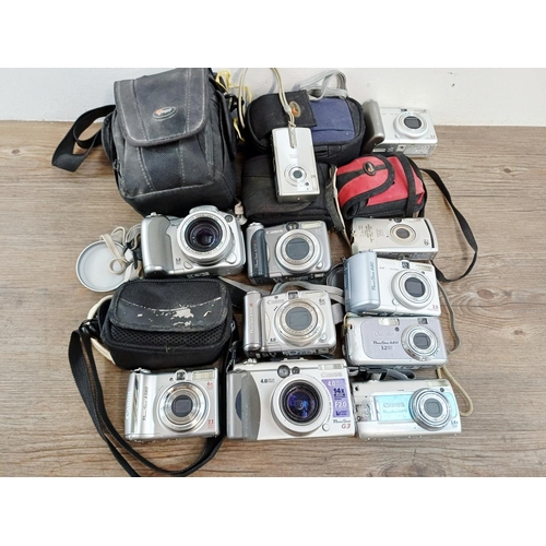 482 - Eleven Canon compact digital cameras to include PowerShot S2 IS 5mp, PowerShot A710 IS 7.1mp, IXUS W... 