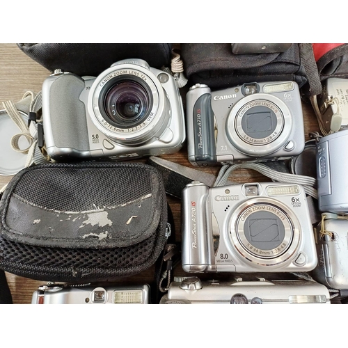 482 - Eleven Canon compact digital cameras to include PowerShot S2 IS 5mp, PowerShot A710 IS 7.1mp, IXUS W... 