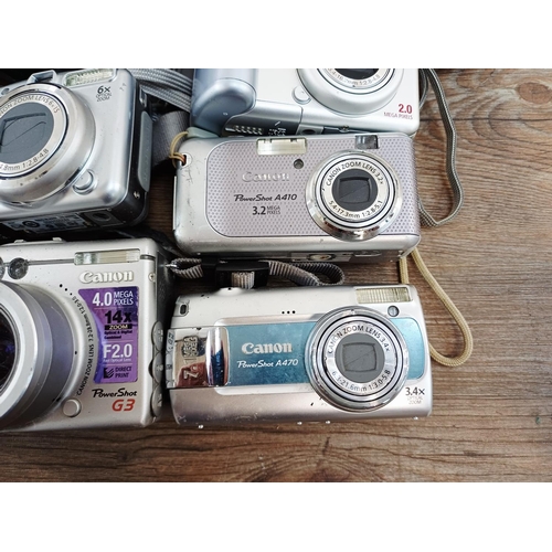 482 - Eleven Canon compact digital cameras to include PowerShot S2 IS 5mp, PowerShot A710 IS 7.1mp, IXUS W... 