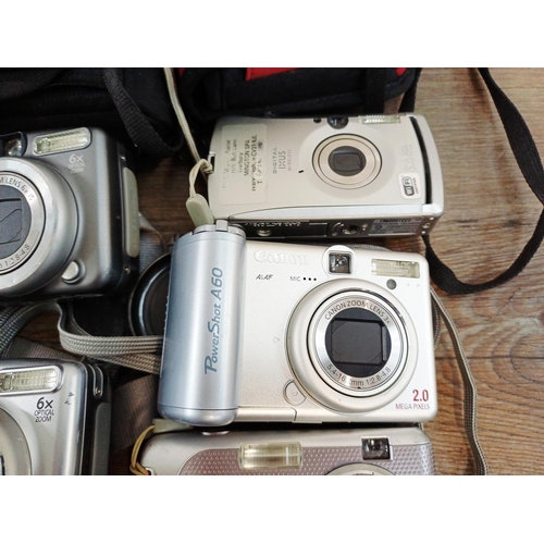 482 - Eleven Canon compact digital cameras to include PowerShot S2 IS 5mp, PowerShot A710 IS 7.1mp, IXUS W... 
