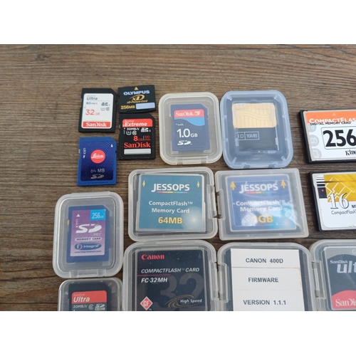 A collection of memory cards to include SanDisk CompactFlash, Leica ...