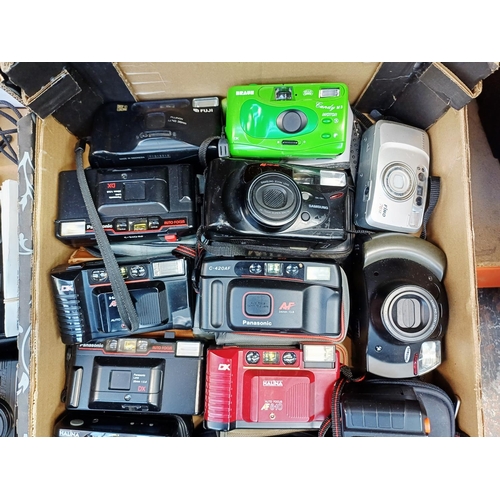 Two boxes containing cameras to include Konica, Yashica, Fuji, Halina etc.