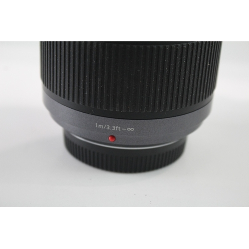 56 - A Panasonic Lumix G Vario 1:4.5-5.6 45-200mm Mega O.I.S. bayonet-mount camera lens with back cap