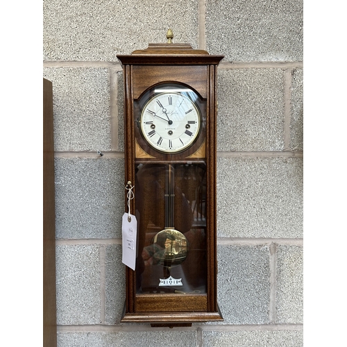 A Knight & Gibbins of London mahogany cased wall clock with