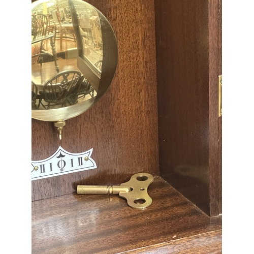 A Knight & Gibbins of London mahogany cased wall clock with