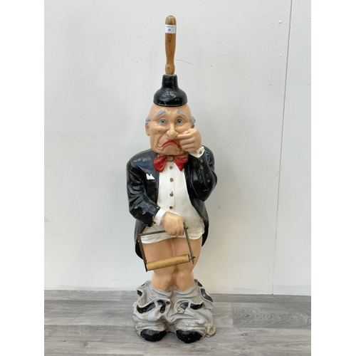 A 'Mr Stinky' hand painted resin novelty butler toilet paper holder ...