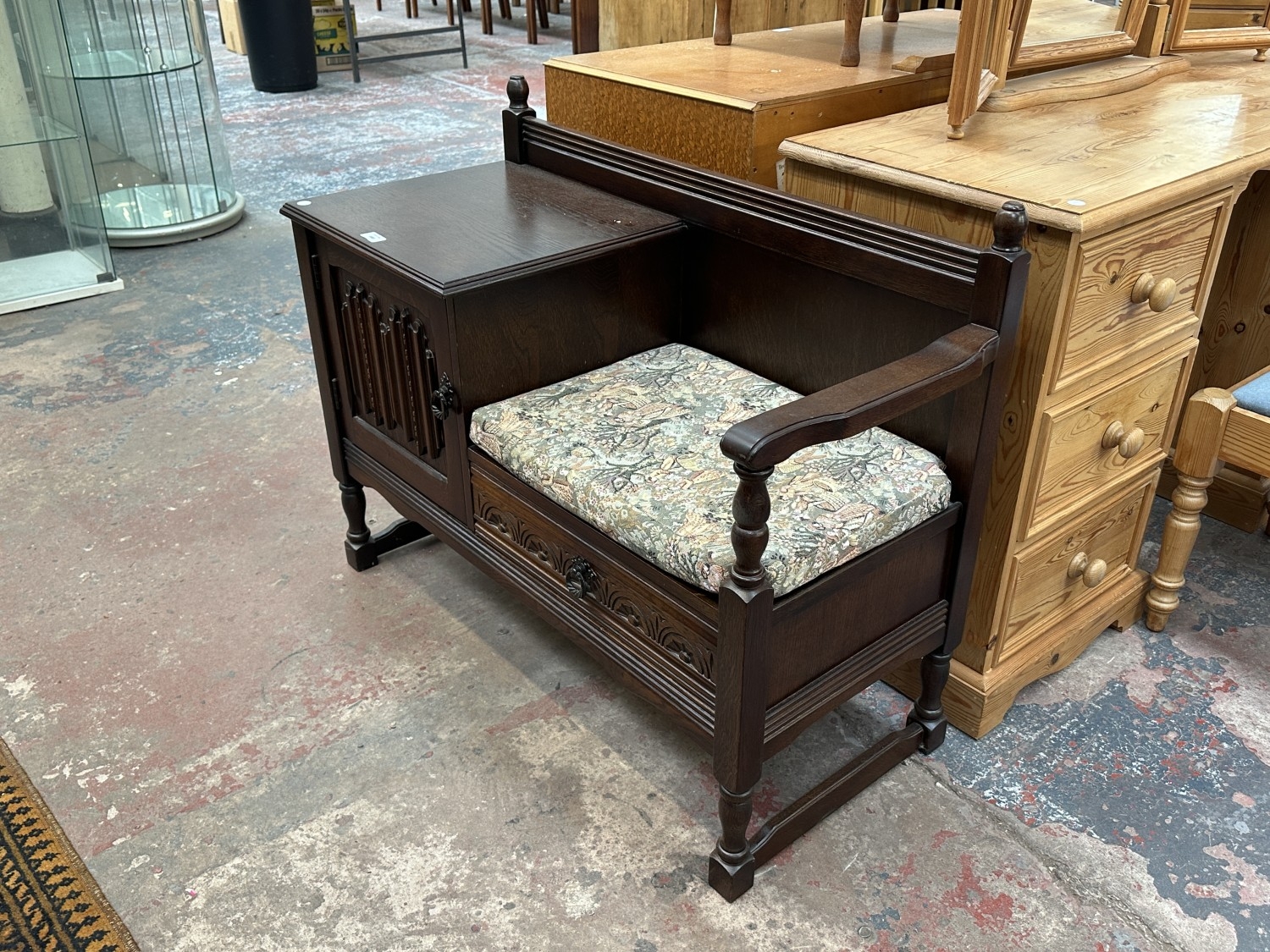 A carved oak linenfold telephone table - approx. 77cm high x 98cm wide ...