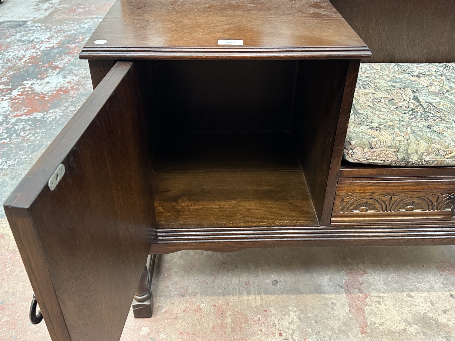 A carved oak linenfold telephone table - approx. 77cm high x 98cm wide ...
