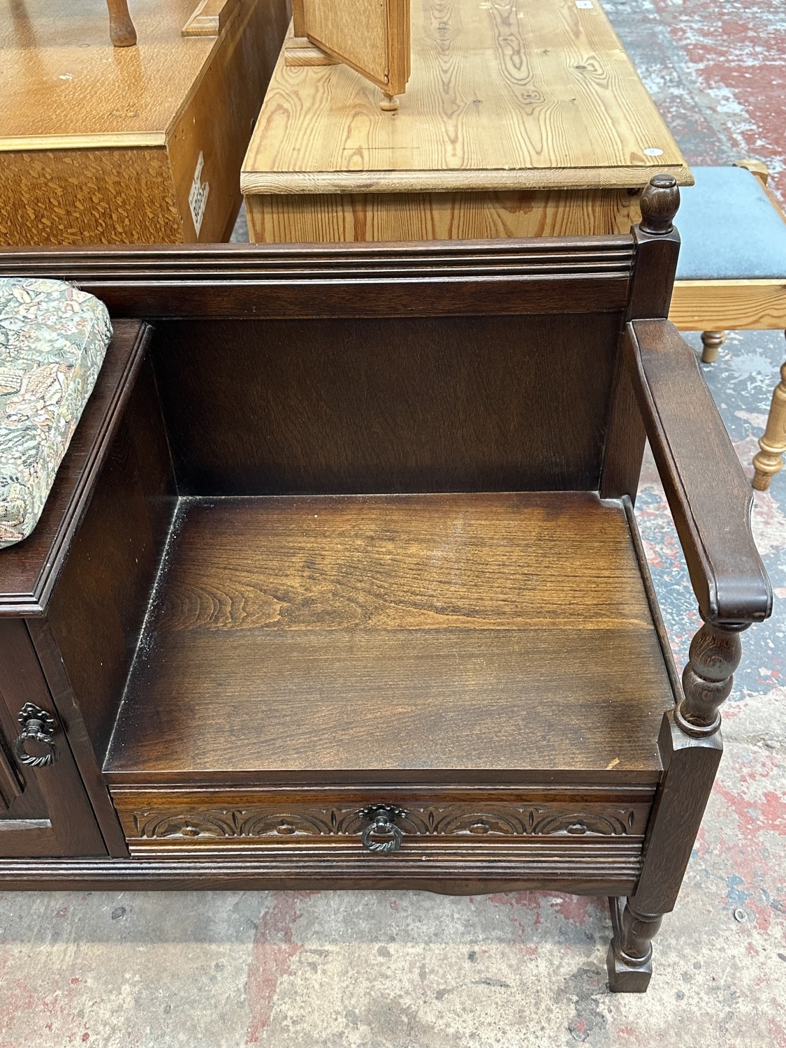 A carved oak linenfold telephone table - approx. 77cm high x 98cm wide ...