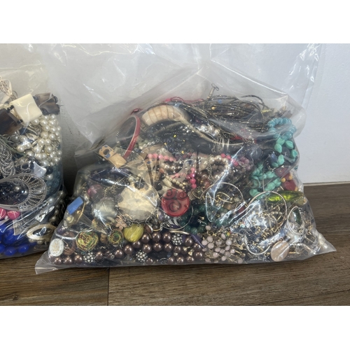 1357 - Four bags containing approx. 19kg of costume jewellery
