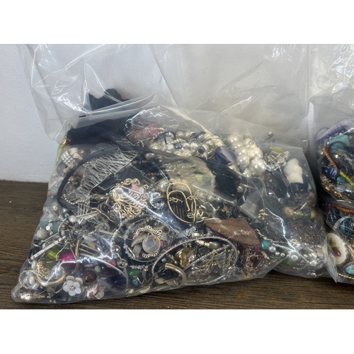 1358 - Four bags containing approx. 19kg of costume jewellery