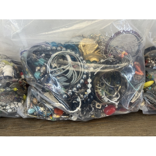 1358 - Four bags containing approx. 19kg of costume jewellery