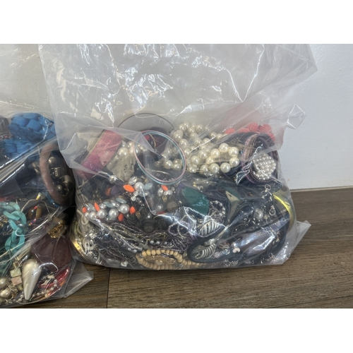 1358 - Four bags containing approx. 19kg of costume jewellery