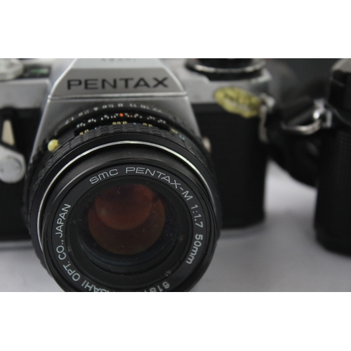 14 - Two 35mm SLR cameras, one Asahi Pentax ME fitted with smc Pentax-M 1:1.7 50mm lens and one Minolta X... 