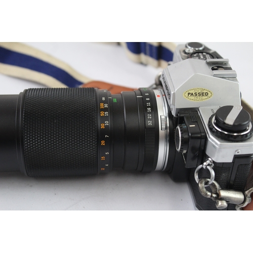 18 - An Olympus OM10 35mm SLR camera fitted with Zuiko Auto-Zoom 1:5 100-200mm lens and Manual Adapter