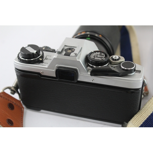 18 - An Olympus OM10 35mm SLR camera fitted with Zuiko Auto-Zoom 1:5 100-200mm lens and Manual Adapter