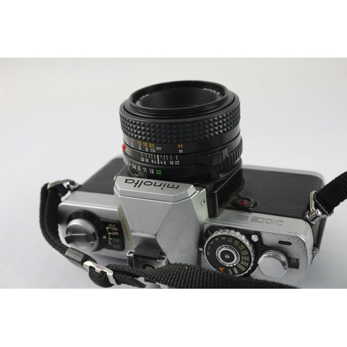 23 - A Minolta XG 9 35mm SLR camera fitted with MD 1:1.7 50mm lens