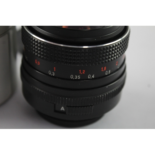 25 - A Carl Zeiss MC Flektogon 1:2.4 35mm M42-mount camera lens with caps