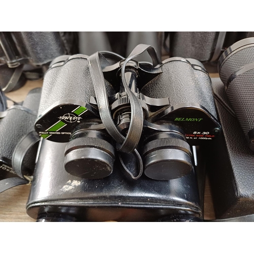 77 - Twelve pairs of binoculars to include cased Swift Belmont 8x30 extra wide field, Docter Optic Dekare... 