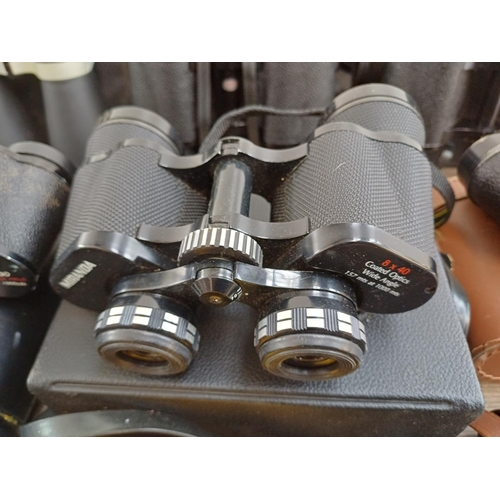 77 - Twelve pairs of binoculars to include cased Swift Belmont 8x30 extra wide field, Docter Optic Dekare... 