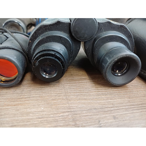 84 - Twelve pairs of binoculars to include cased Optisan Leo-III 8x40, Hilkinson Ultra V 9x35 wide angle,... 