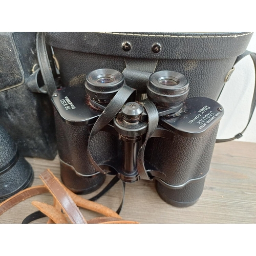 84 - Twelve pairs of binoculars to include cased Optisan Leo-III 8x40, Hilkinson Ultra V 9x35 wide angle,... 