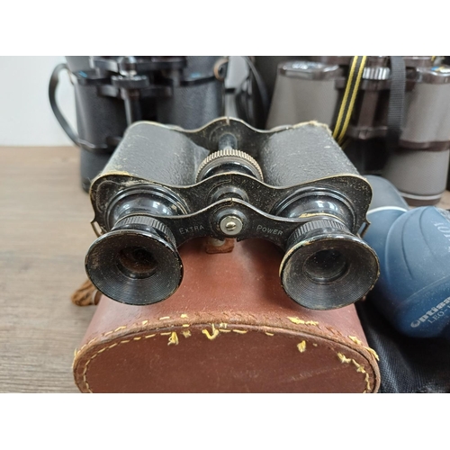 84 - Twelve pairs of binoculars to include cased Optisan Leo-III 8x40, Hilkinson Ultra V 9x35 wide angle,... 