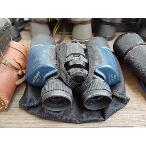 84 - Twelve pairs of binoculars to include cased Optisan Leo-III 8x40, Hilkinson Ultra V 9x35 wide angle,... 