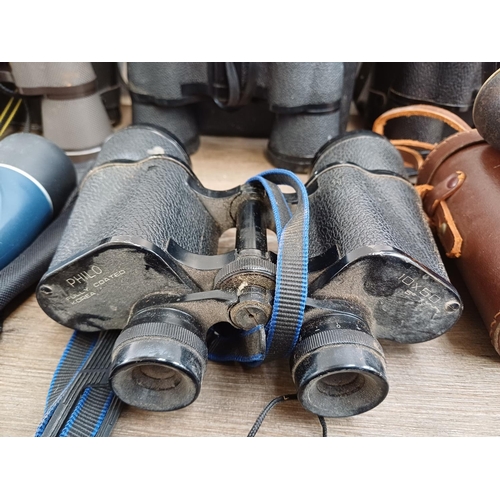 84 - Twelve pairs of binoculars to include cased Optisan Leo-III 8x40, Hilkinson Ultra V 9x35 wide angle,... 