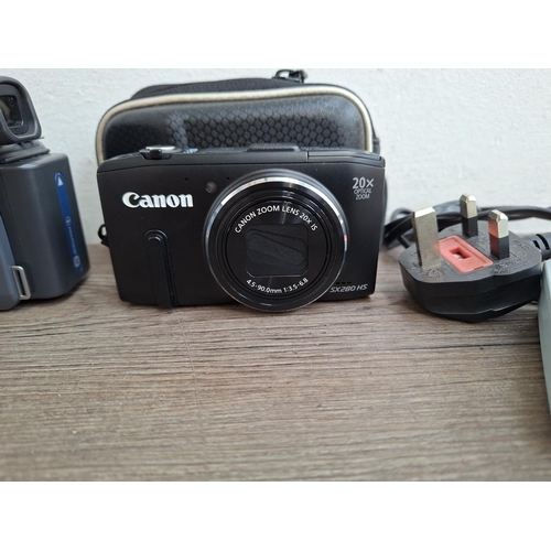 79 - Three digital cameras, one Canon PowerShot SX280 HS 12.1mp BSI-CMOS sensor compact with battery and ... 