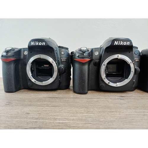 106 - Five Nikon DSLR camera bodies, four D80 and one D70