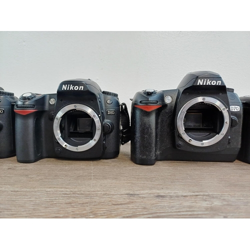 106 - Five Nikon DSLR camera bodies, four D80 and one D70