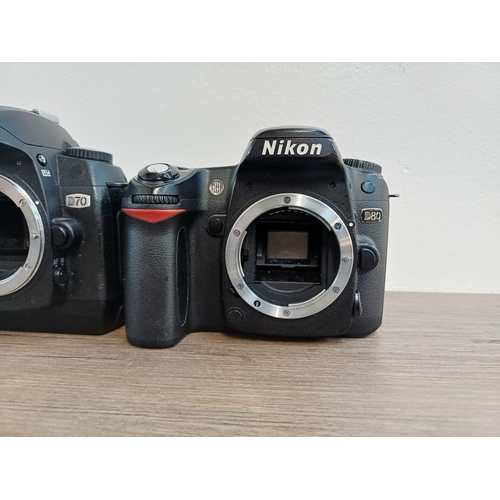 106 - Five Nikon DSLR camera bodies, four D80 and one D70
