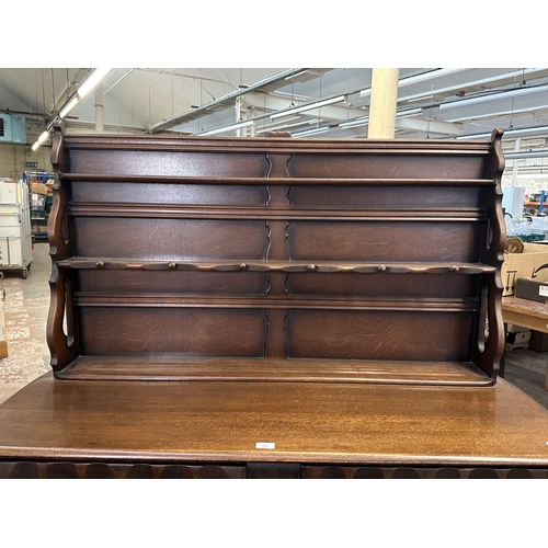 21 - A mid 20th century Ercol style oak dresser - approx. 158cm high x 133cm wide x 50cm deep