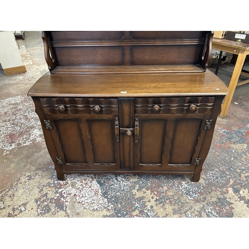 21 - A mid 20th century Ercol style oak dresser - approx. 158cm high x 133cm wide x 50cm deep