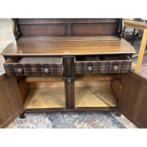 21 - A mid 20th century Ercol style oak dresser - approx. 158cm high x 133cm wide x 50cm deep