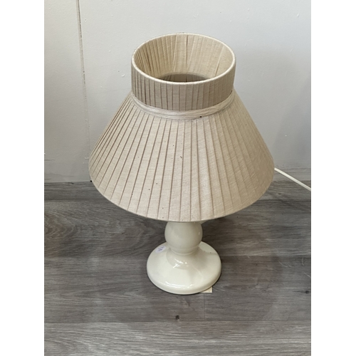 56 - Four ceramic table lamps to include two Chinese hand painted with bird and foliage design - largest ... 