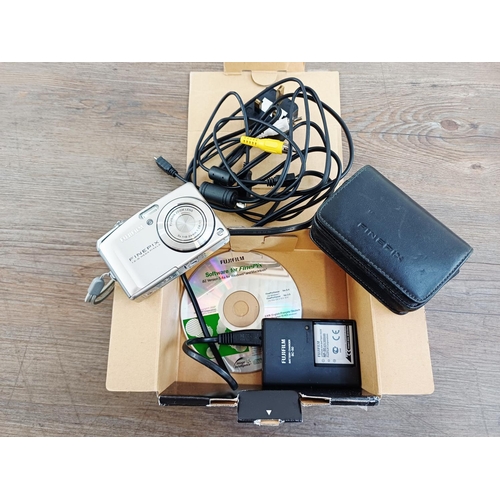 118 - Two boxed Fujifilm FinePix CCD sensor compact digital cameras, one F50fd 12mp with two batteries, ch... 