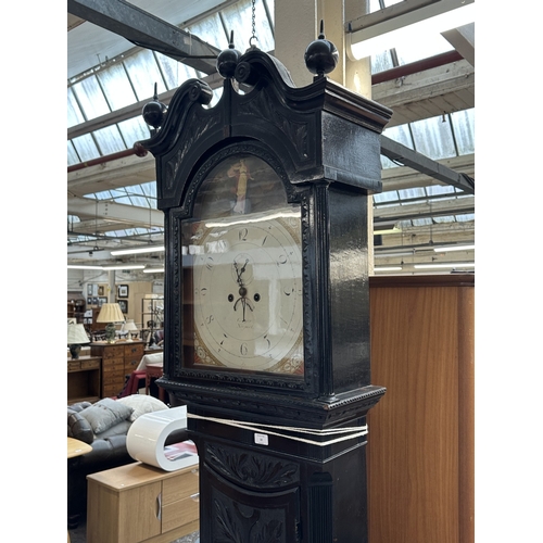 10 - A Georgian Cooper of Newport ebonised and carved oak cased grandfather clock with hand painted ename... 