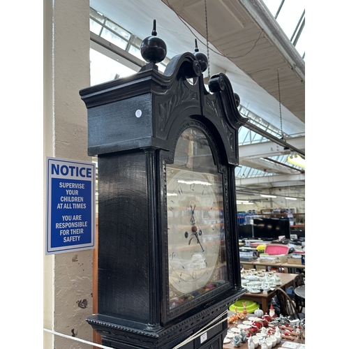 10 - A Georgian Cooper of Newport ebonised and carved oak cased grandfather clock with hand painted ename... 