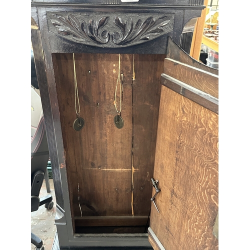 10 - A Georgian Cooper of Newport ebonised and carved oak cased grandfather clock with hand painted ename... 