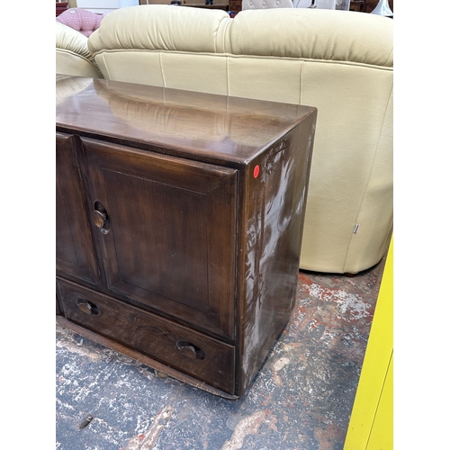 16 - An Ercol Model 468 elm sideboard - approx. 76cm high x 128cm wide x 43cm deep