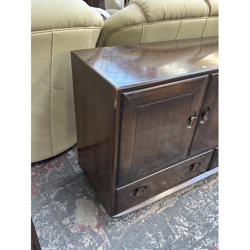 16 - An Ercol Model 468 elm sideboard - approx. 76cm high x 128cm wide x 43cm deep
