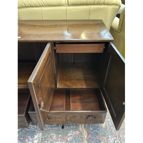 16 - An Ercol Model 468 elm sideboard - approx. 76cm high x 128cm wide x 43cm deep