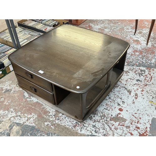18 - An Ercol elm Pandora coffee table - approx. 40cm high x 79cm wide x 79cm deep